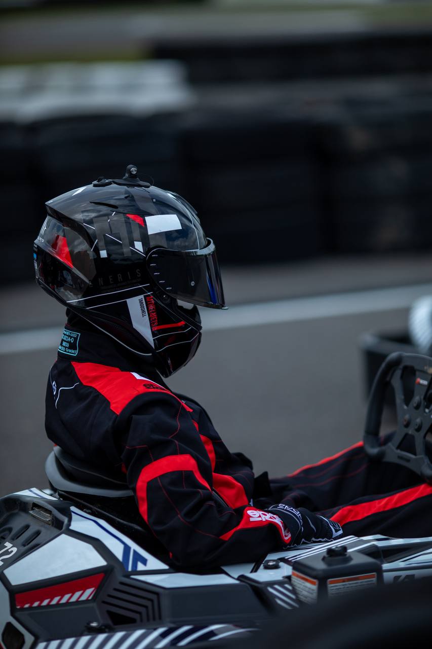 Kseniia focused in a kart before racing
